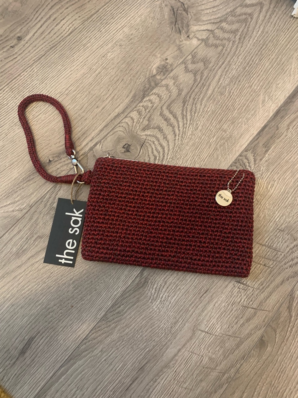 The Sak Burgundy Knit Wristlet Clutch with silver Charm